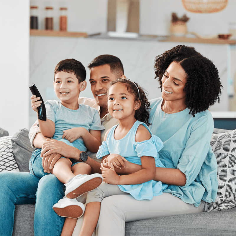 family-on-couch-blue-clothes